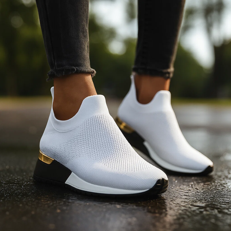 Women's slip-on sneakers with sock-style ankle upper and metallic heel accent