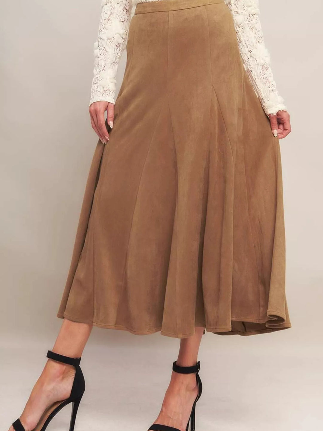 Camel panelled midi skirt with flared hem styled with black ankle strap heels