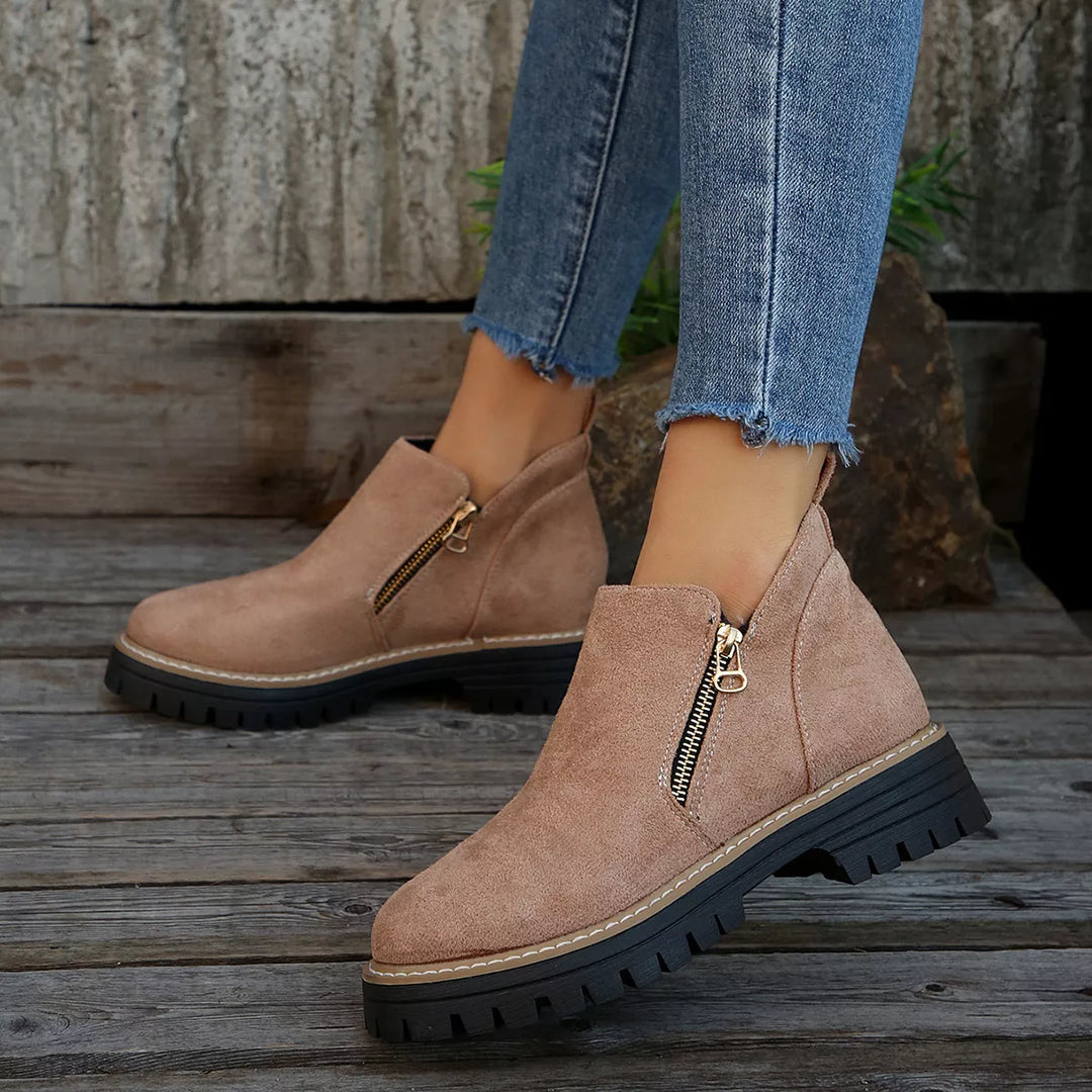 Dusty rose chunky ankle boots with side zipper worn with cuffed jeans