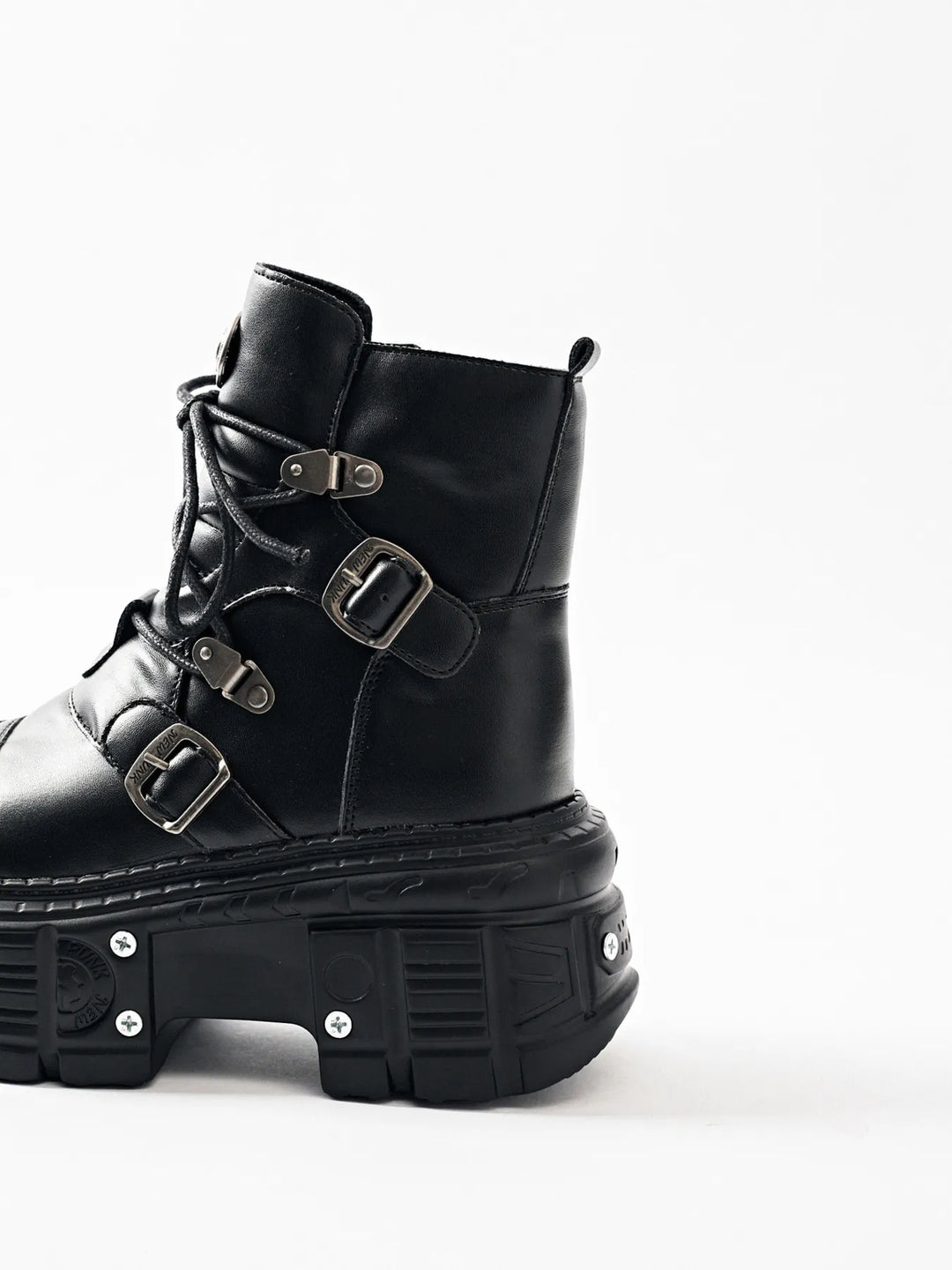 Black chunky platform boot in side view with multiple buckle straps