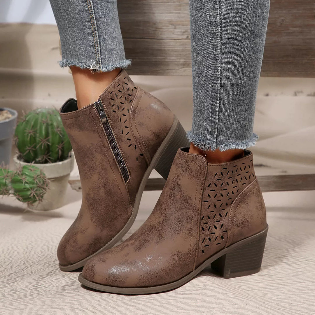 Brown block heel ankle boots with side zipper worn with cuffed jeans