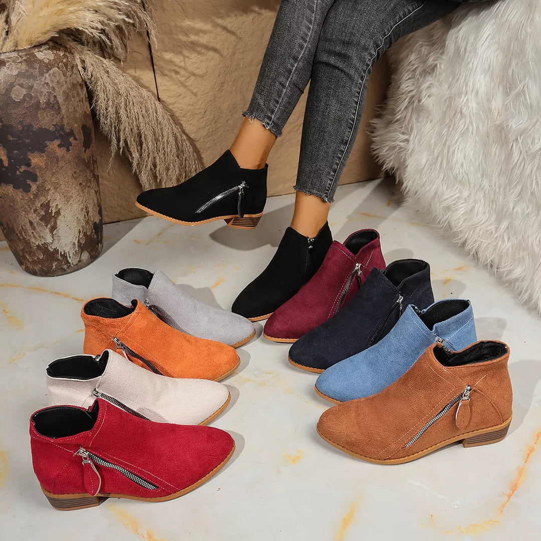 Women's ankle boots in nine colors lined up, pointed toe block heel with side zip