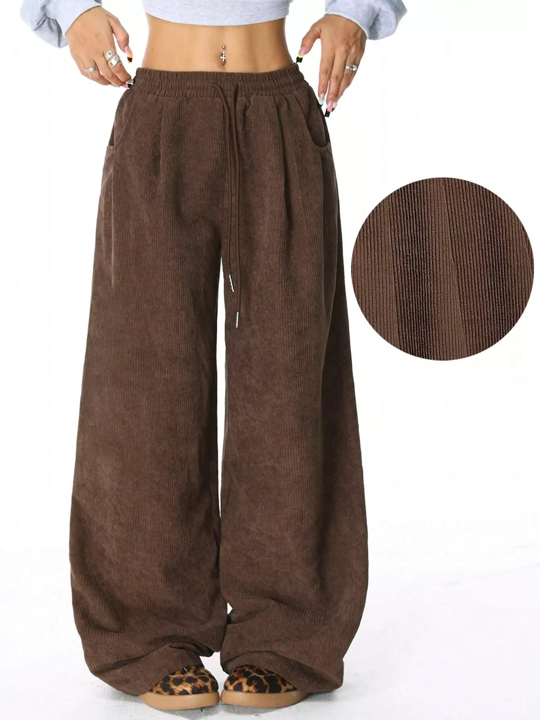Brown wide leg drawstring pants with fabric texture circle inset
