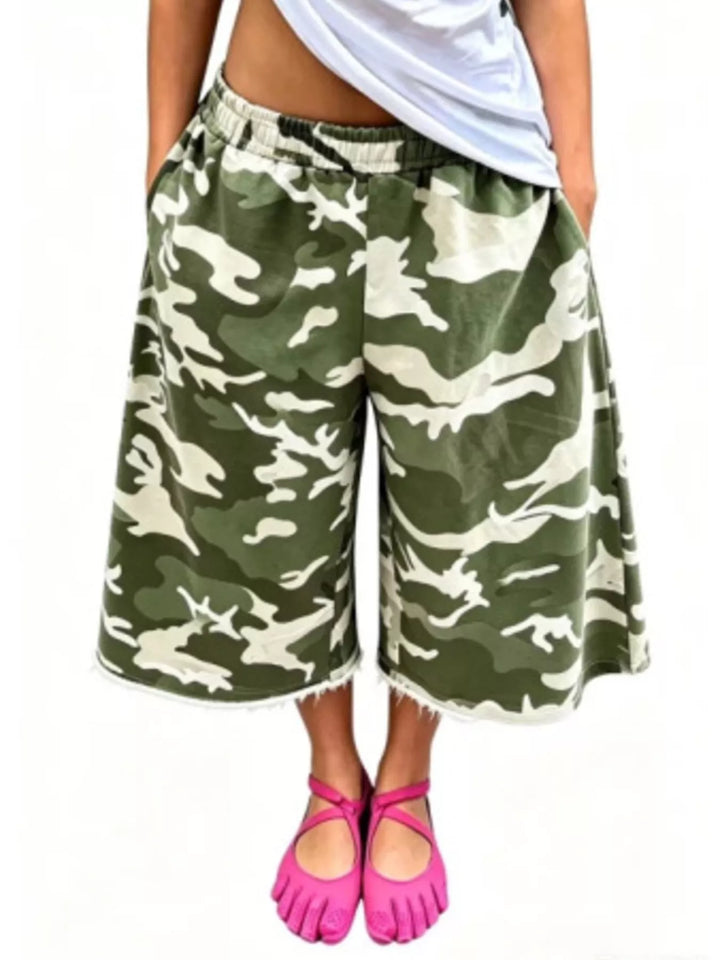 Green camo baggy shorts in a light green pattern, front view