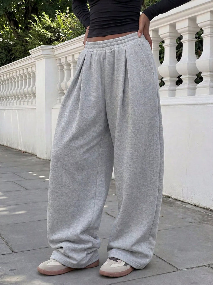 Light gray wide leg sweatpants, side angle showing the relaxed fit