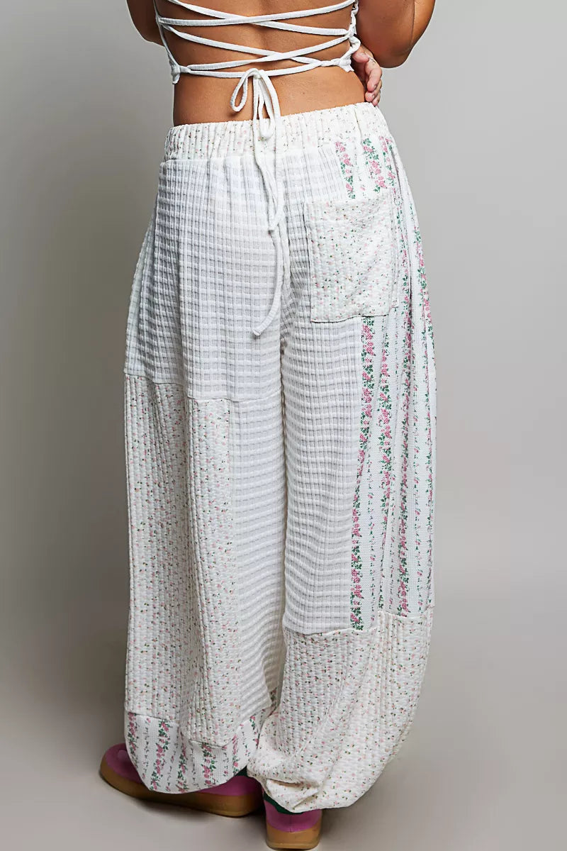 Back view of the ivory waffle knit balloon pants with tie back top