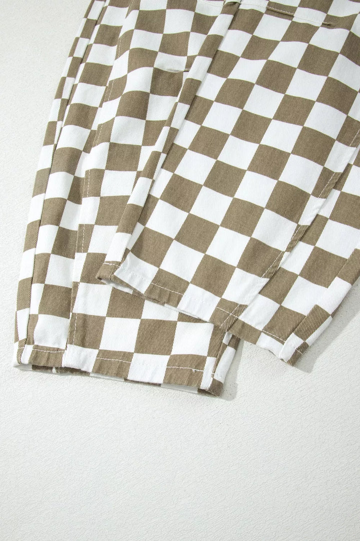 Hem of the khaki checkerboard pants folded to show the leg opening