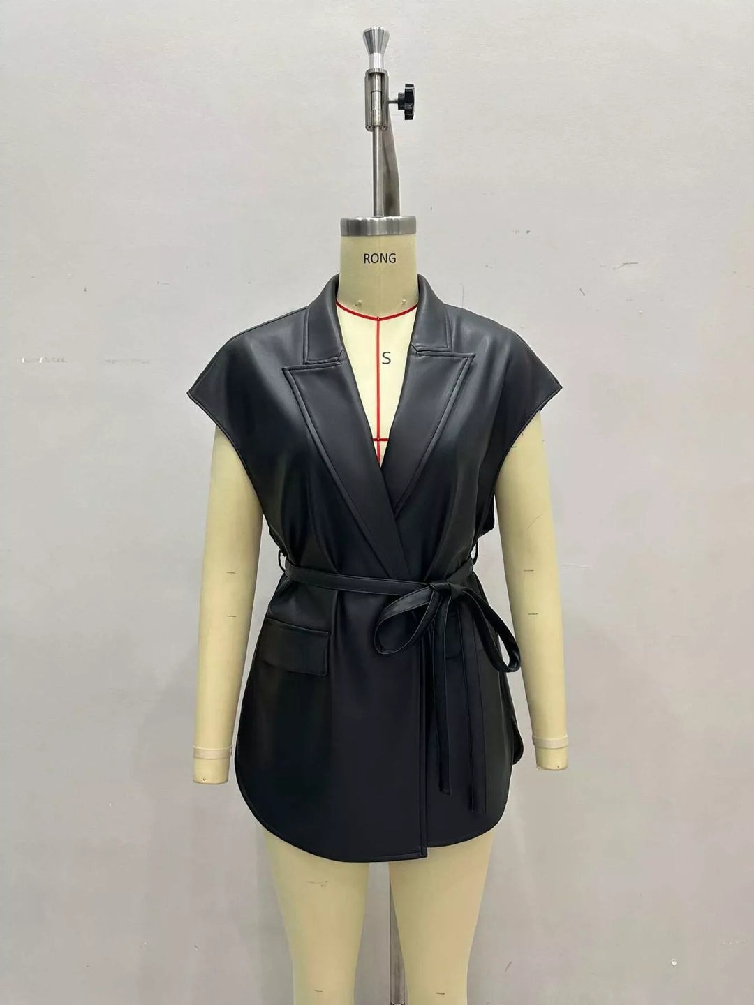 Black belted vest with notch lapel shown on a mannequin