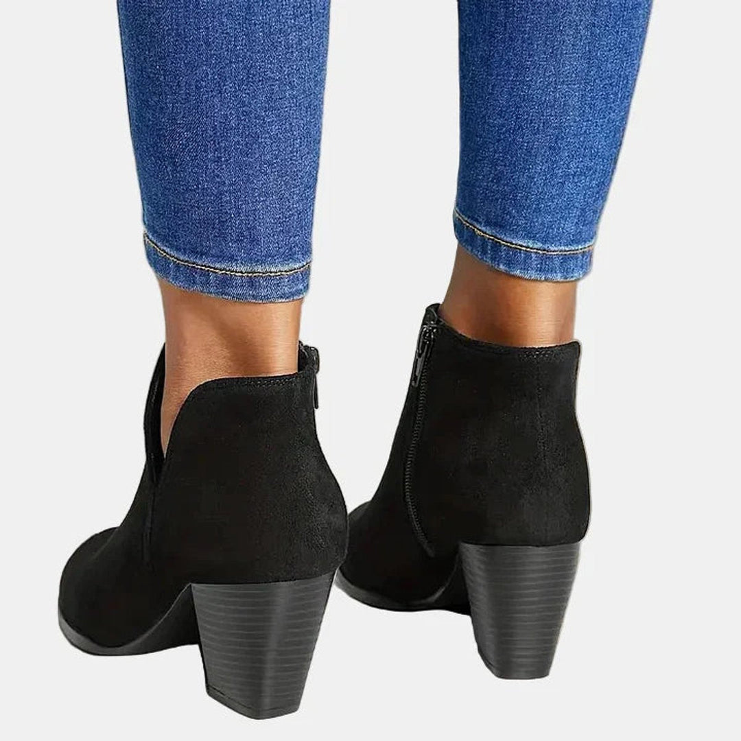Back view of black ankle boots with stacked block heel