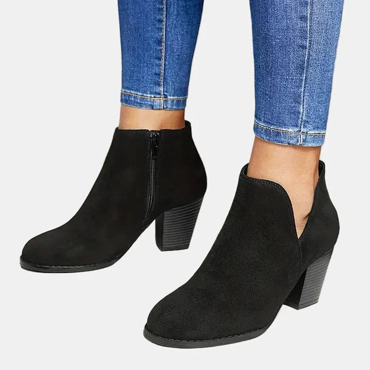 Black suede-look ankle boots with block heel worn with cropped denim