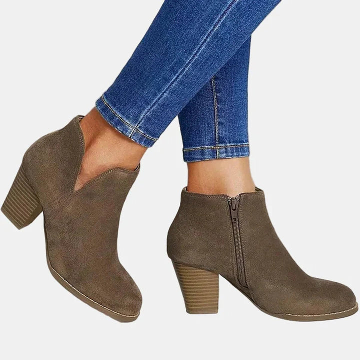 Taupe ankle boots in motion with stacked block heel