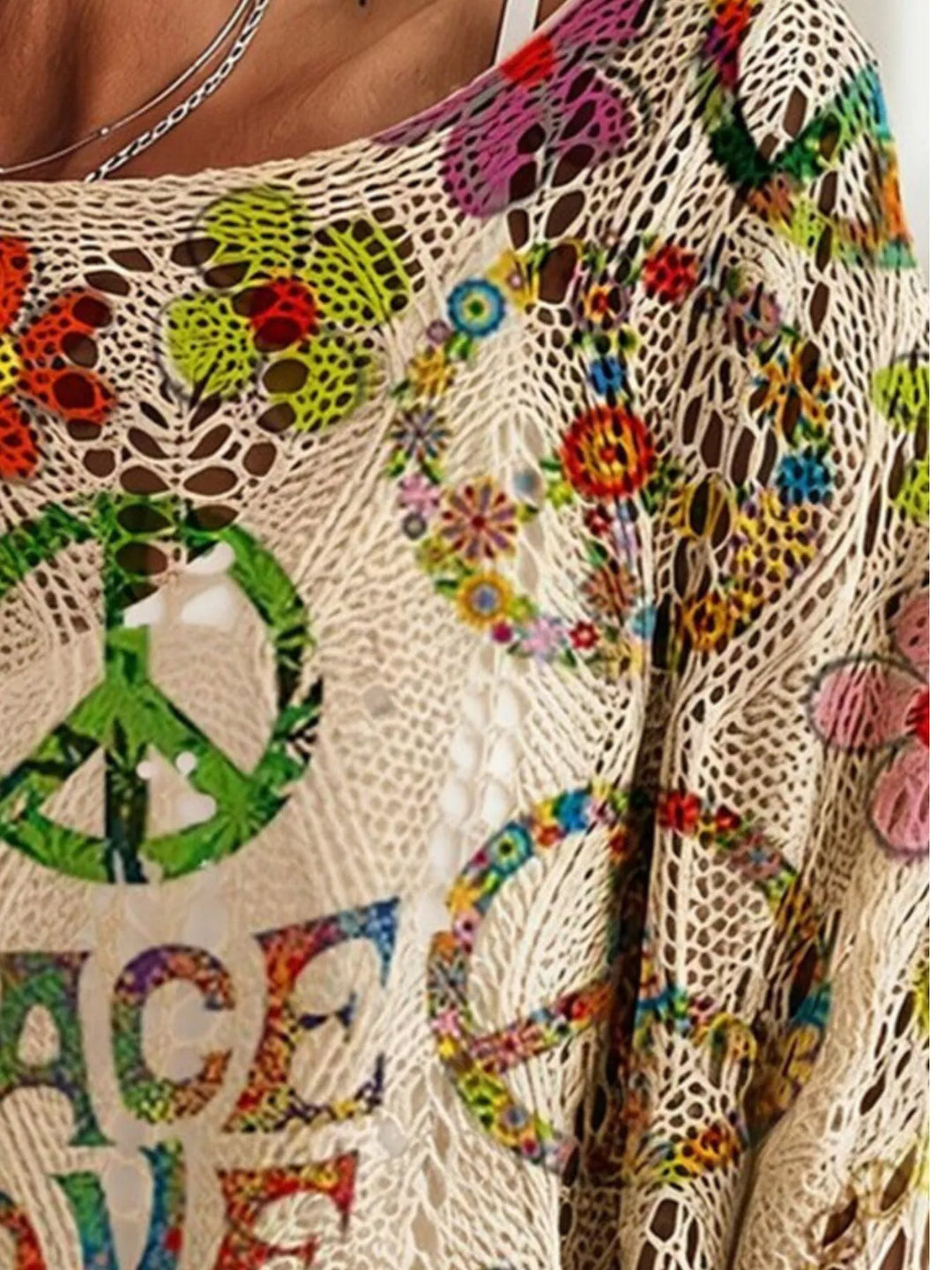 Open crochet texture and peace symbol print on the boho top sleeve