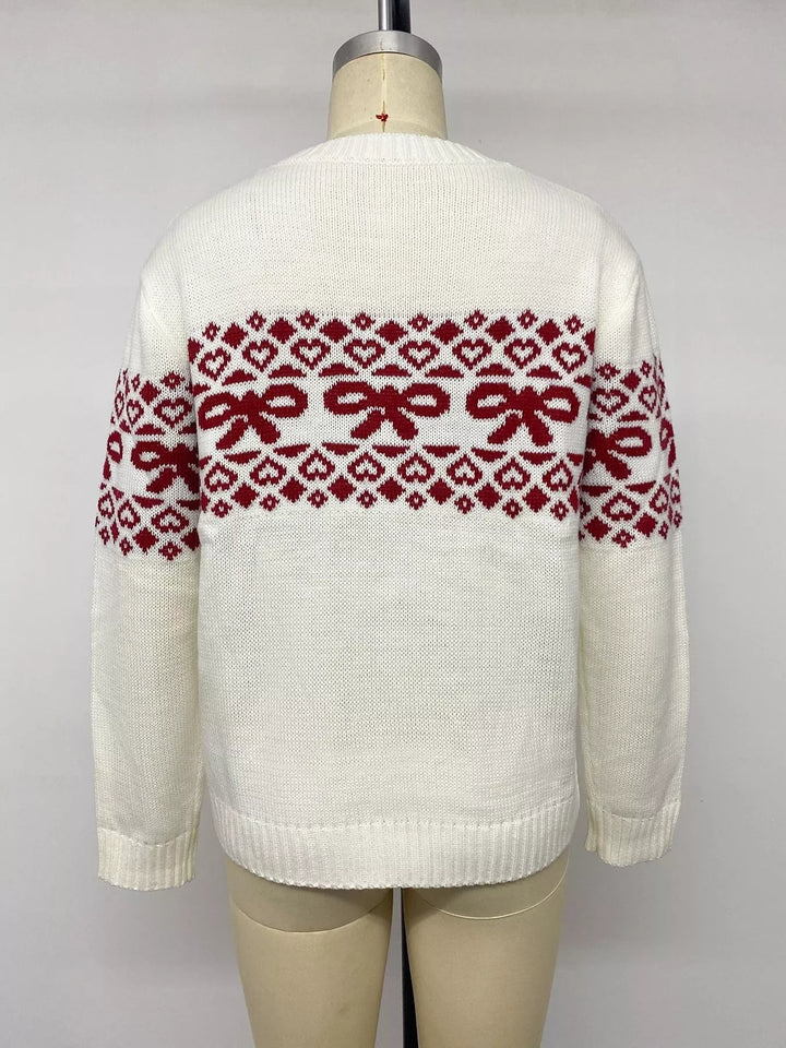 Back view of the white bow sweater on a mannequin showing the jacquard band