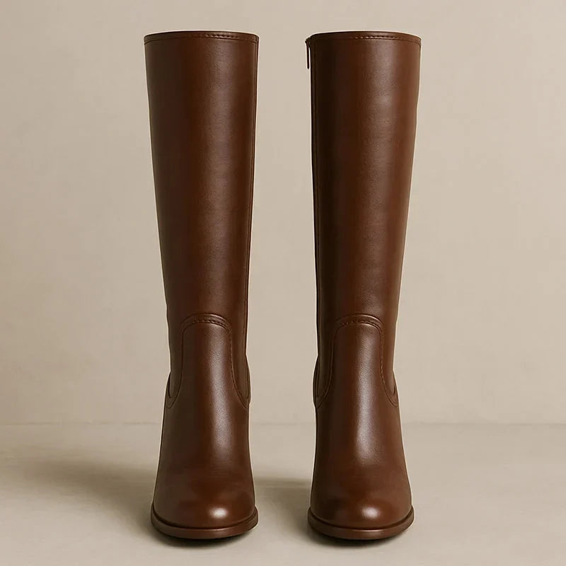 Back view of brown knee high boots with smooth shaft and block heel