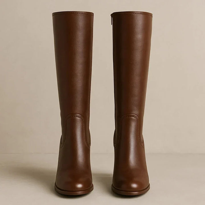 Back view of brown knee high boots with smooth shaft and block heel