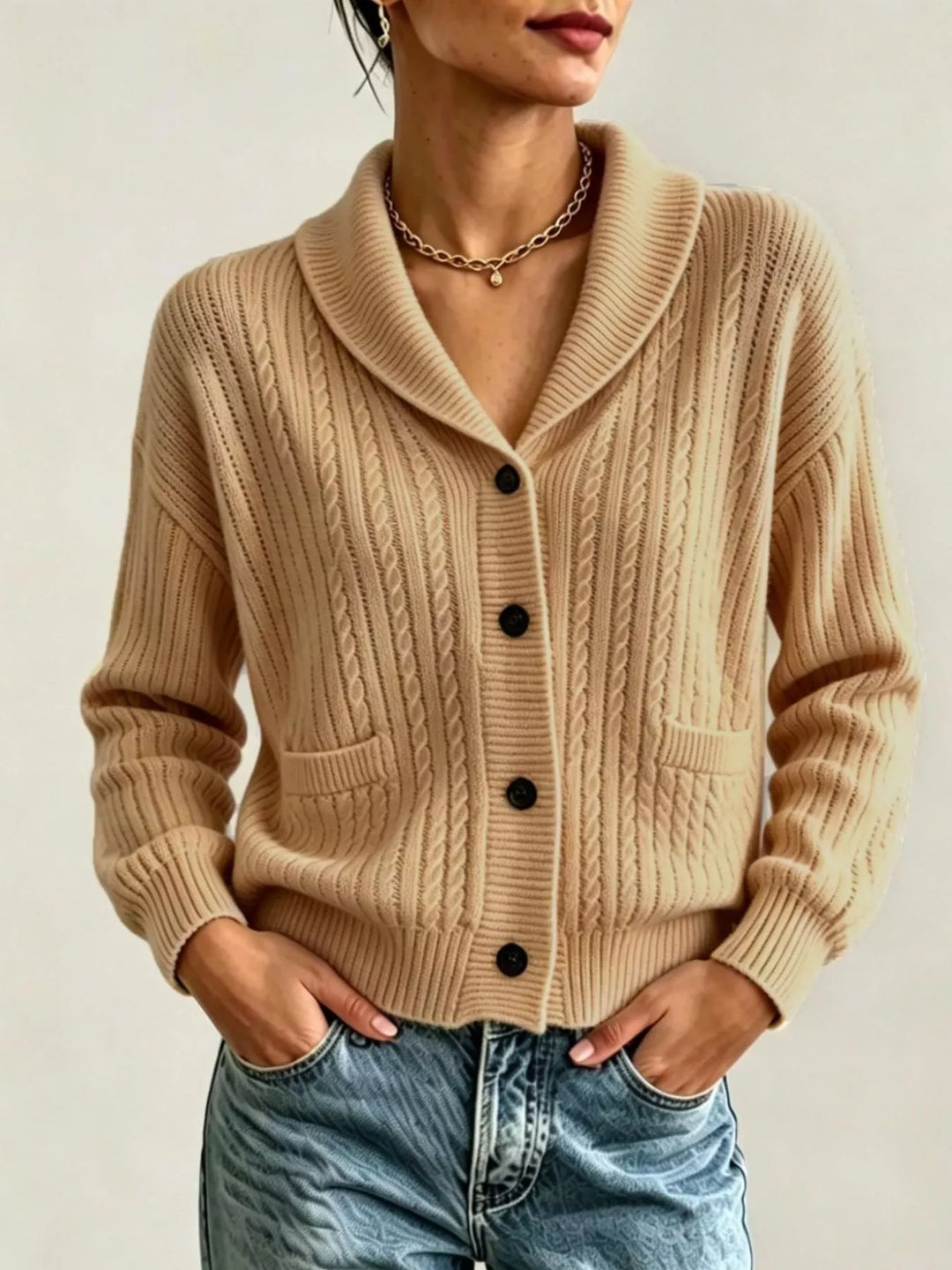 Women's button up cardigan in camel, shawl collar cable knit with pockets, front view