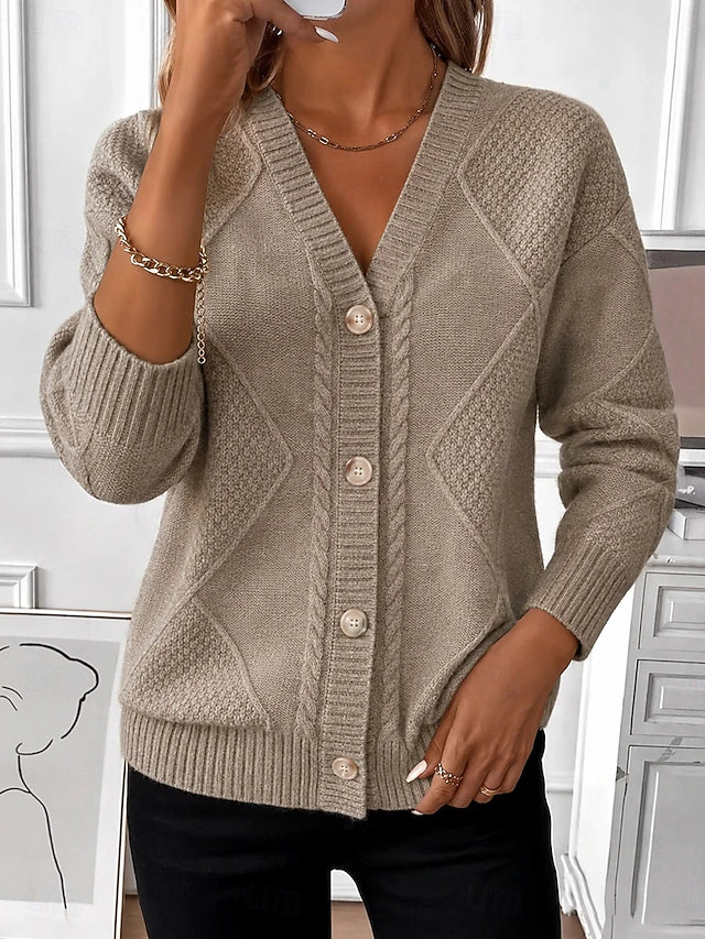 Model wearing the taupe cable knit cardigan with a V-neck and button front