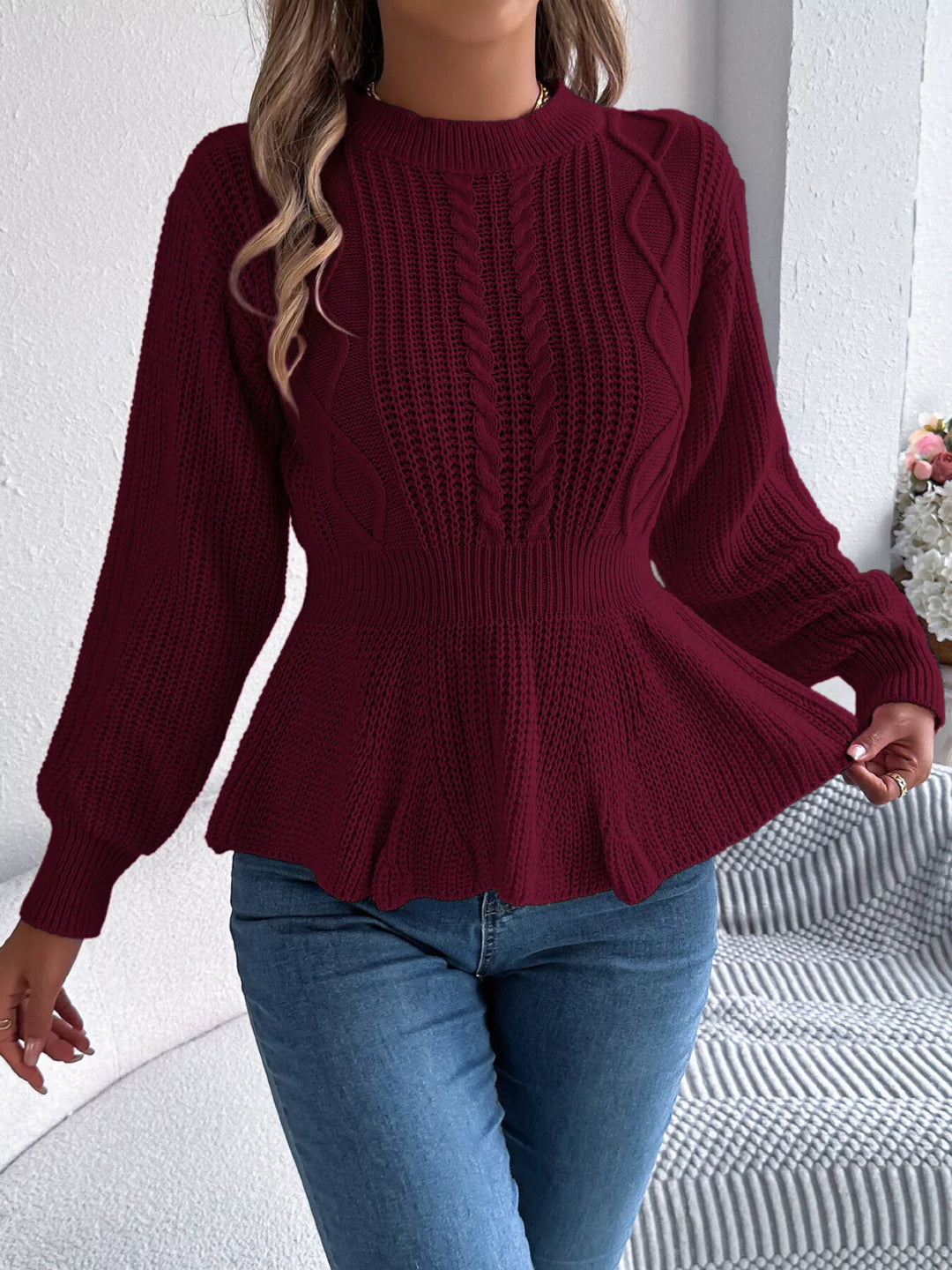 Burgundy crew neck peplum sweater with ruffled hem, standing front view