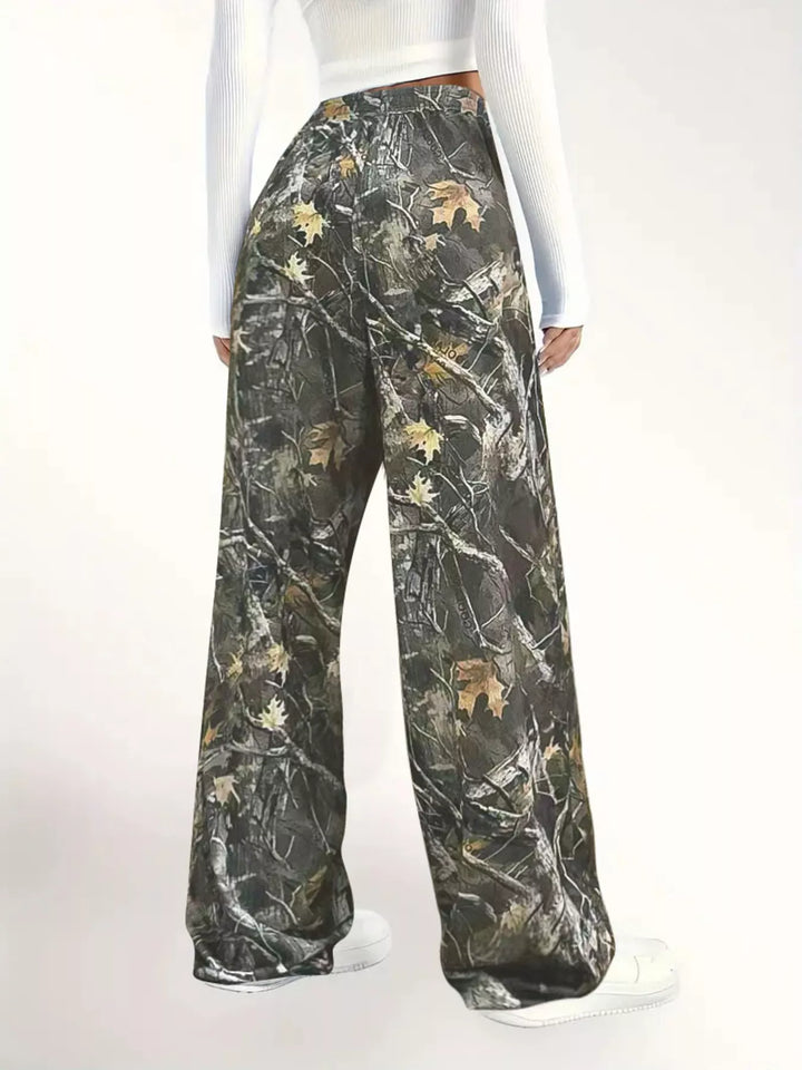 Back view of the camo wide leg pants with white sneakers