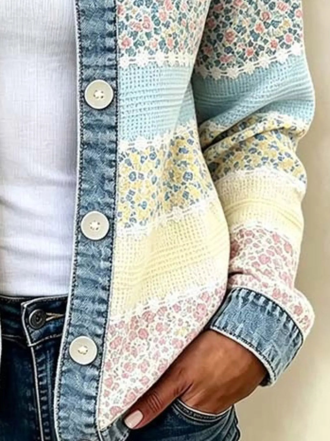 Pastel striped cardigan button placket and denim cuff, hand in jeans pocket