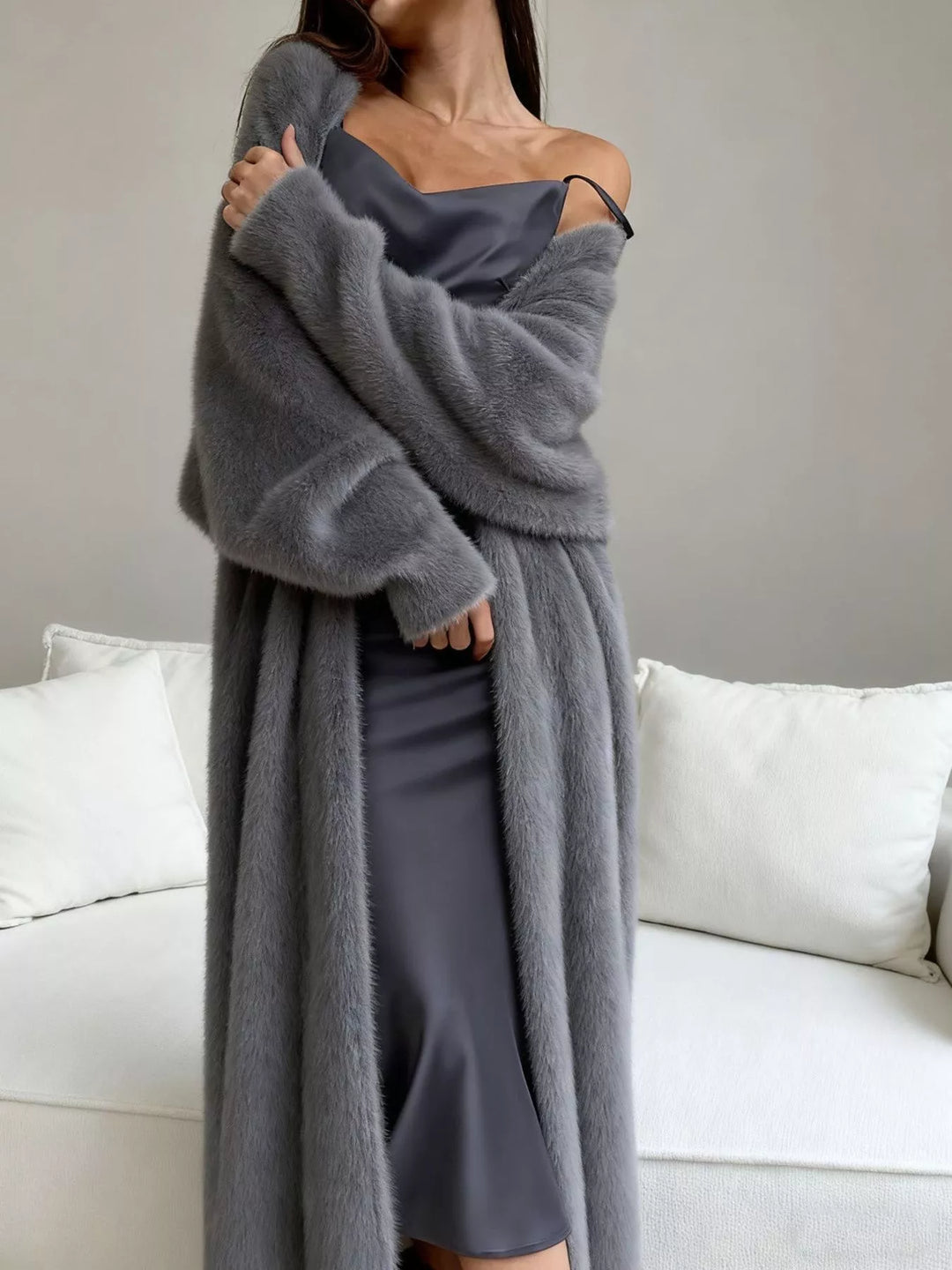 Gray fuzzy longline cardigan with dropped shoulder worn open over a satin slip dress