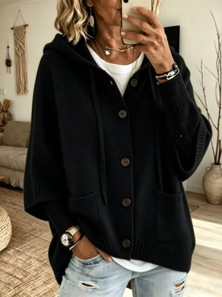 Black hooded button front cardigan with batwing sleeves and ribbed hem