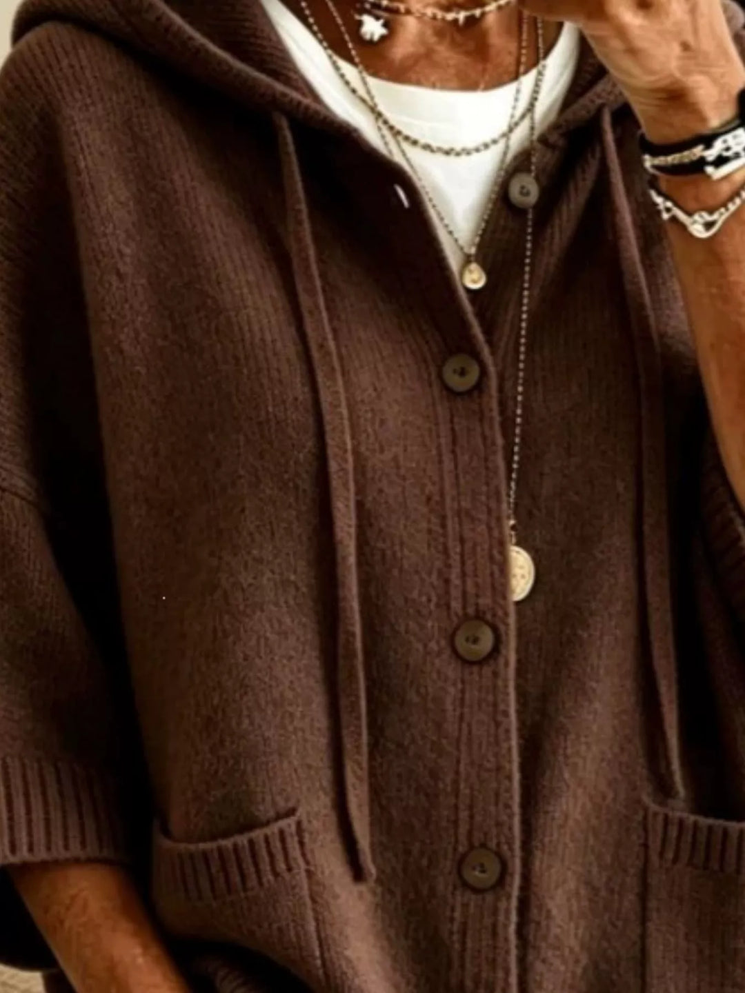 Brown hooded cardigan close-up of the drawstrings and sleeve