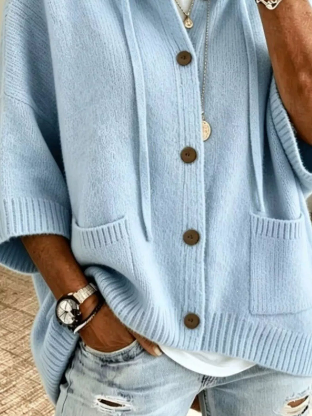 Light blue batwing sleeve cardigan close-up of the buttons and pocket