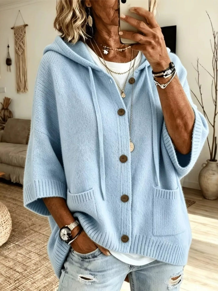Light blue hooded cardigan with batwing sleeves and front patch pockets