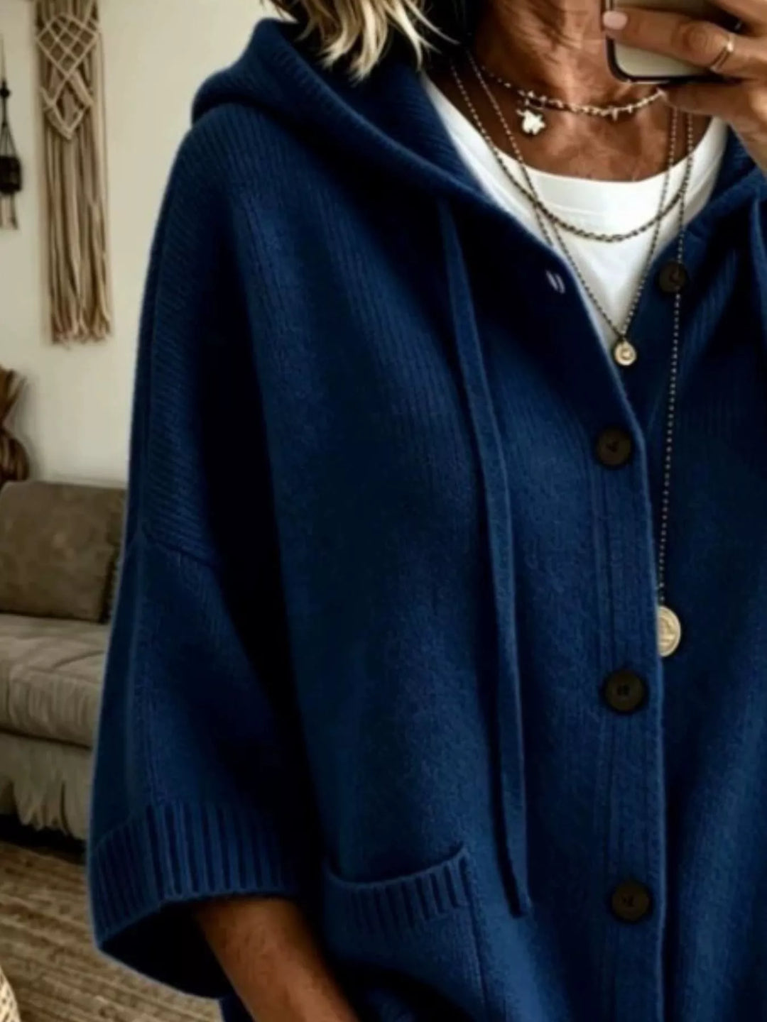 Navy hooded cardigan close-up of the drawstrings and button placket