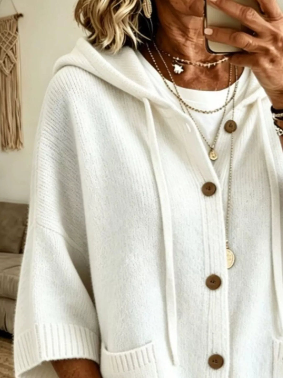 White batwing sleeve cardigan close-up of the hood, drawstrings and buttons