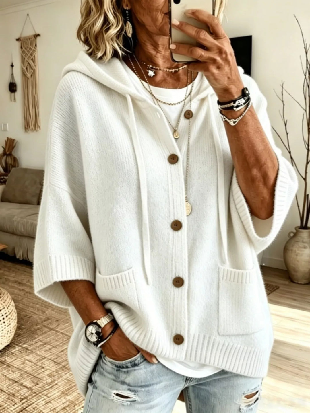 White hooded button front cardigan with batwing sleeves and pockets