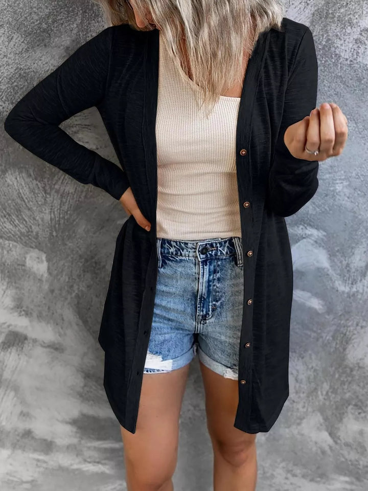 Long black lightweight cardigan with buttons over a cream tank