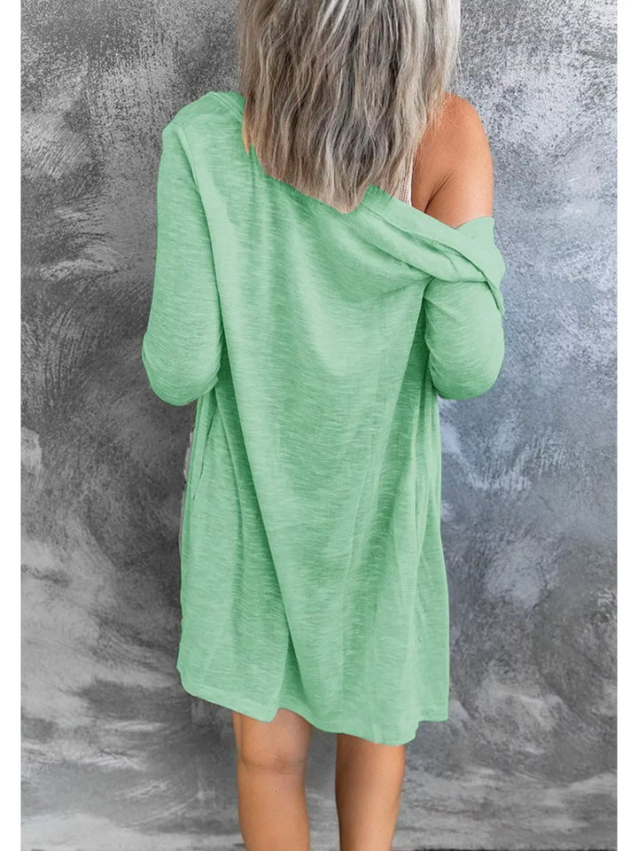 Mint green cardigan back view with relaxed longline fit