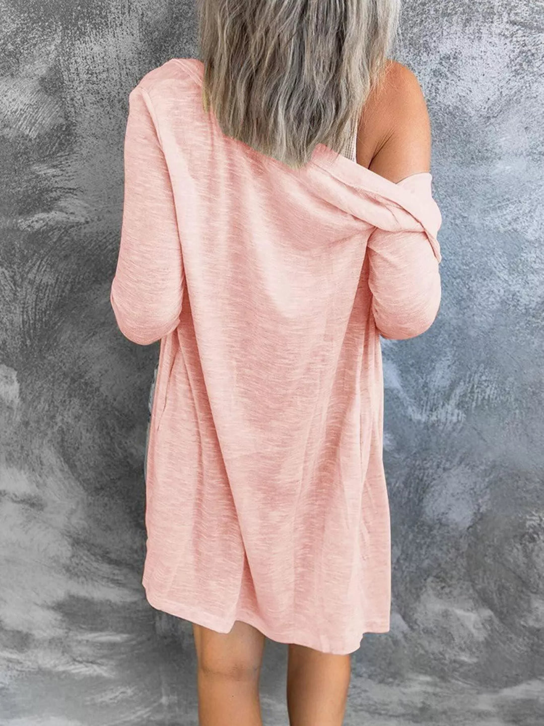 Back view of peach longline cardigan with soft drape