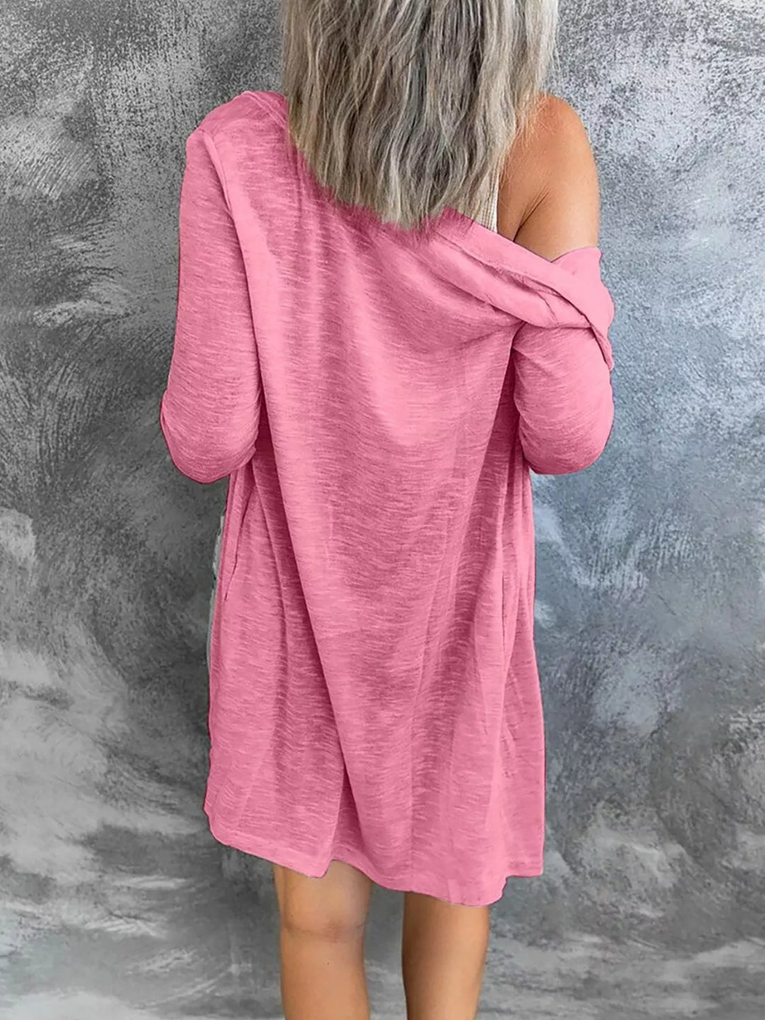 Back view of pink lightweight cardigan with relaxed drape