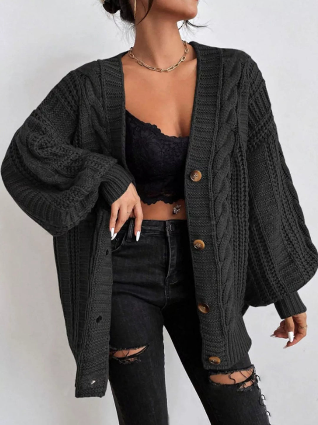 Chunky cable knit button front v-neck in black, front view