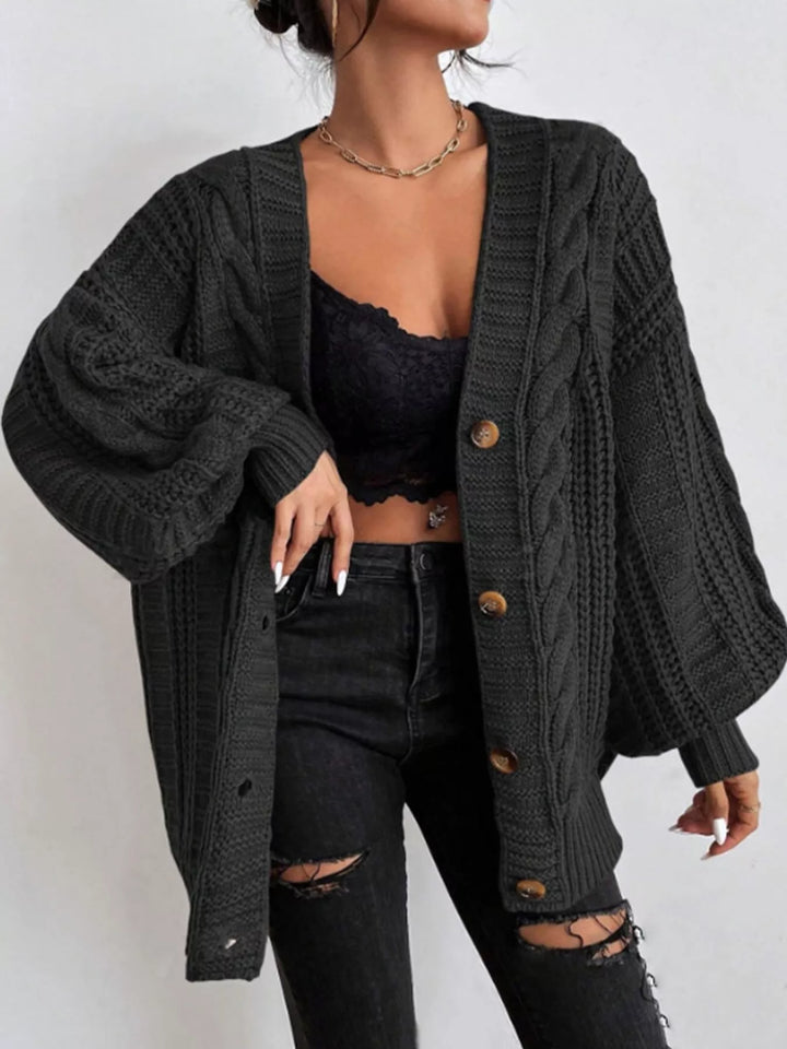 Chunky cable knit button front v-neck in black, front view