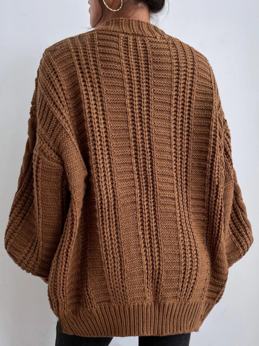Chunky cable knit button front v-neck in dark brown, back view