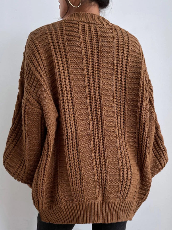 Chunky cable knit button front v-neck in dark brown, back view