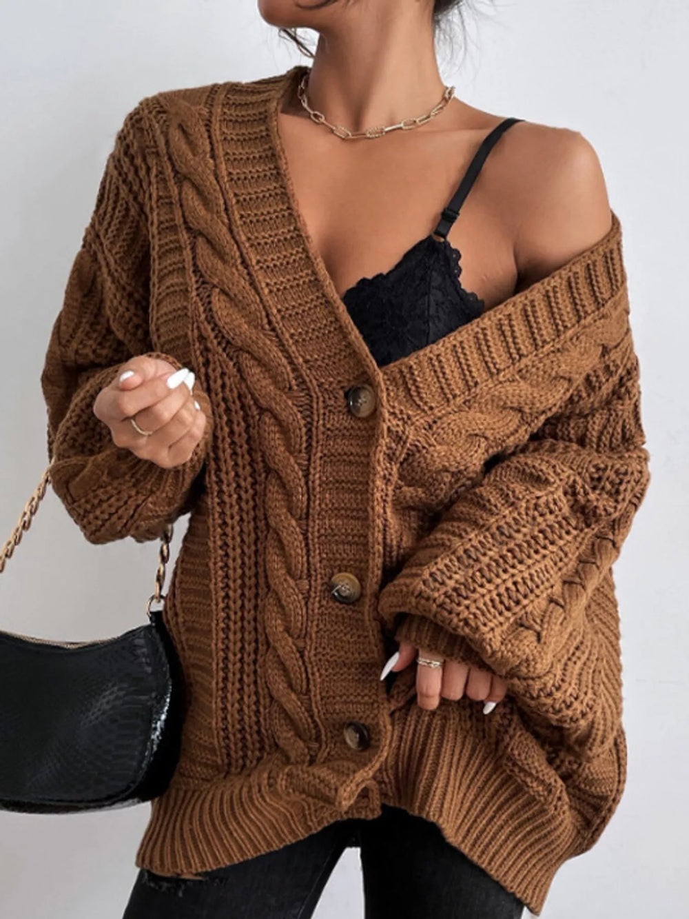 Chunky cable knit button front v-neck in dark brown, styled on model