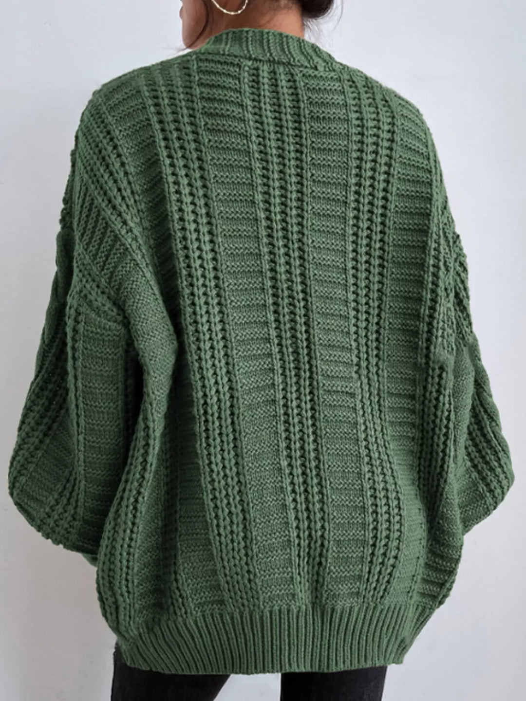 Chunky cable knit button front v-neck in green, back view