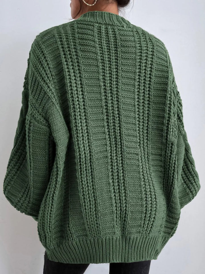 Chunky cable knit button front v-neck in green, back view