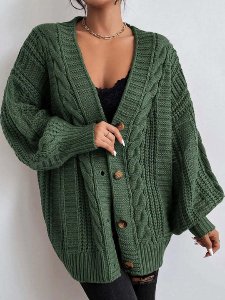 Chunky cable knit button front v-neck in green, front view