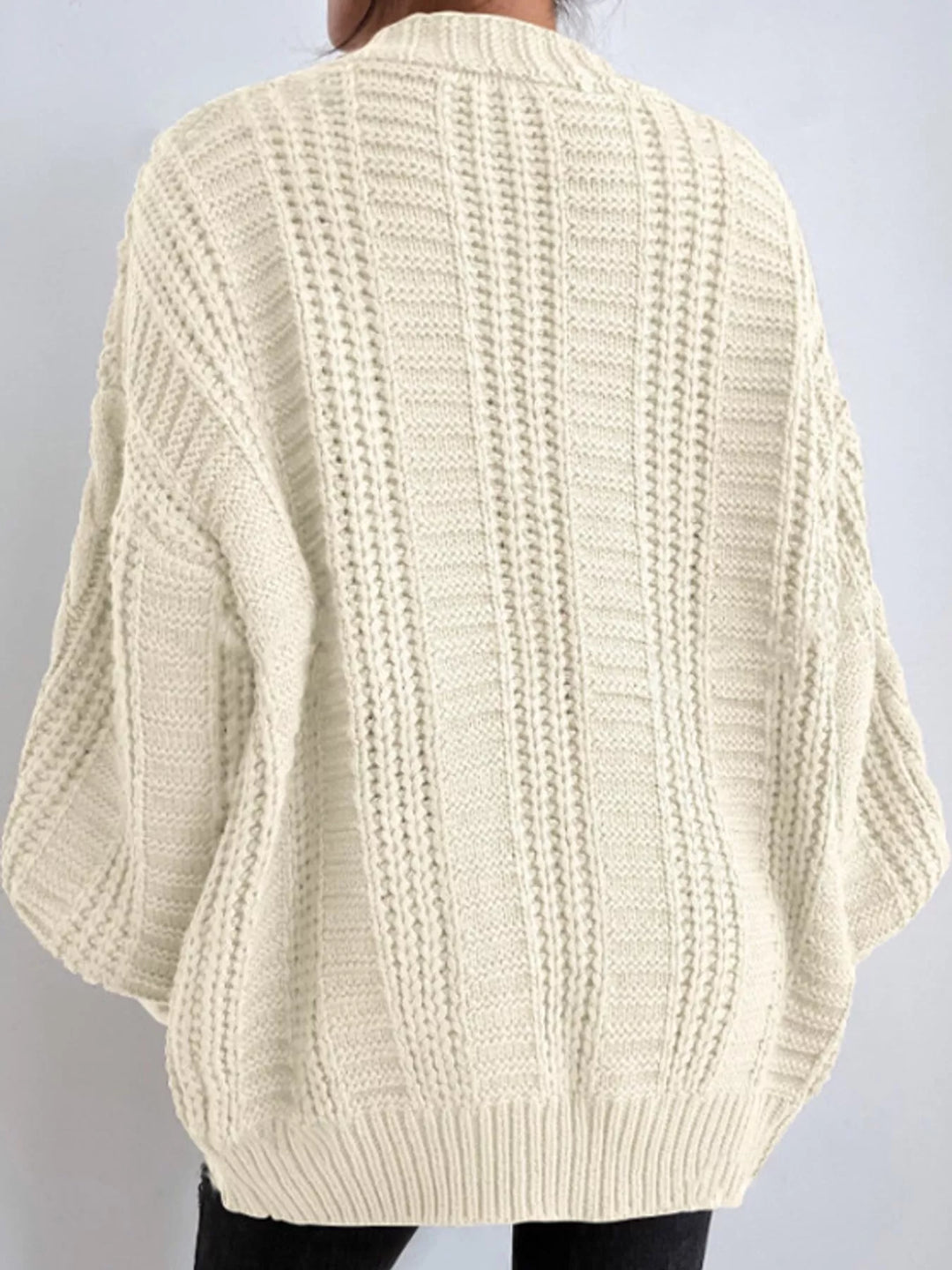 Chunky cable knit button front v-neck in off-white, back view