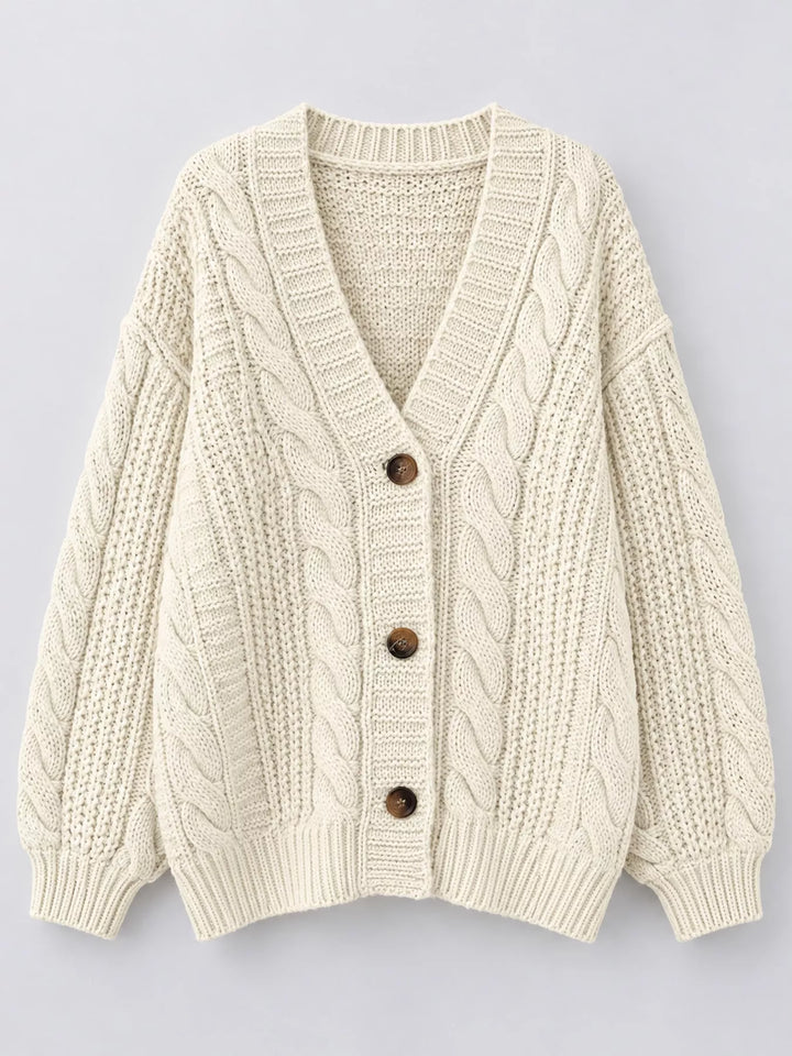 Chunky cable knit button front v-neck in off-white, flat lay