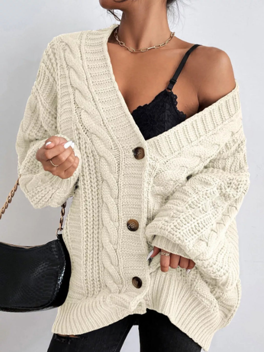 Chunky cable knit button front v-neck in off-white, front view