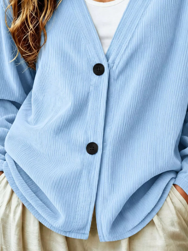 Corduroy-look ribbed v-neck button up in light blue, close-up detail