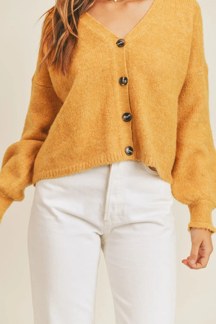 Cropped v-neck balloon sleeve in mustard, close-up detail