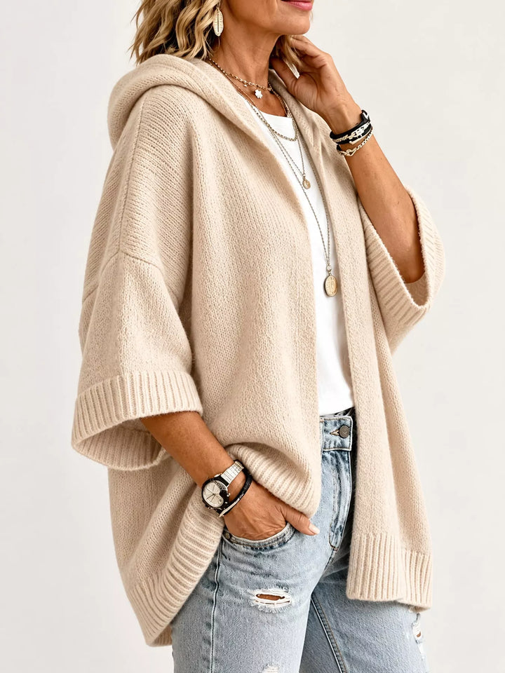 Hooded open front drop shoulder in apricot color, styled on model